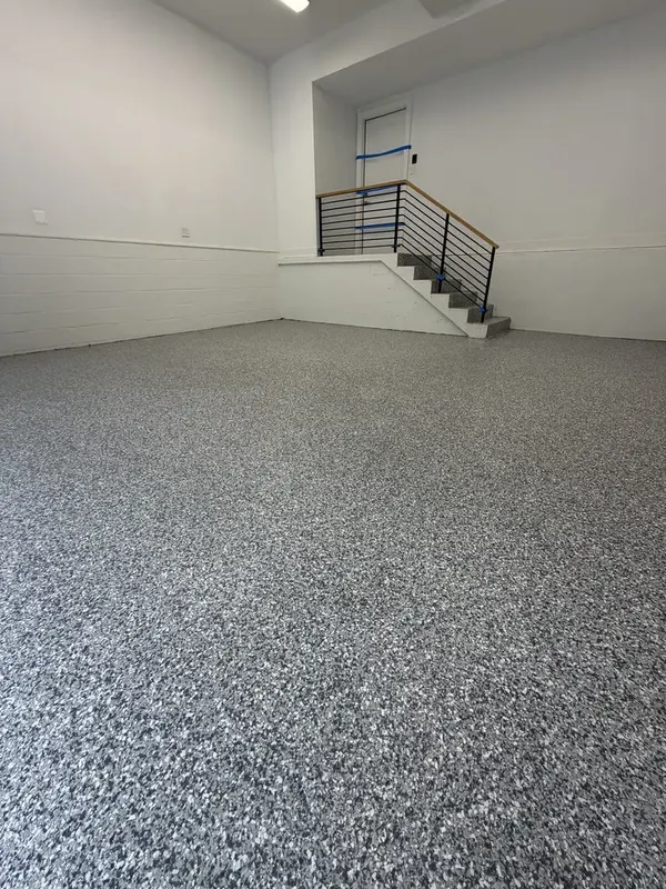 Wide view of the finished Gravel flake garage floor from the entrance in Washington, DC