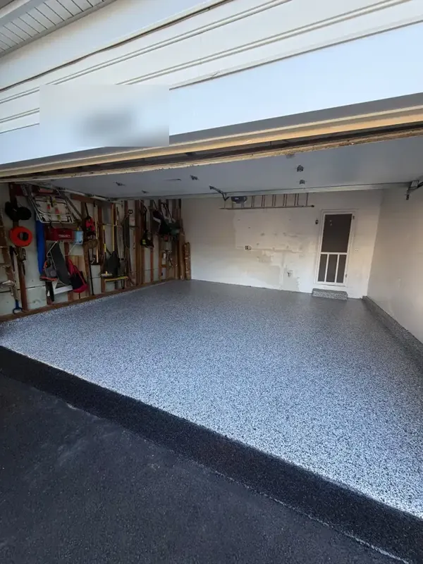 Finished Domino flake garage floor seen from the driveway in Silver Spring, Maryland