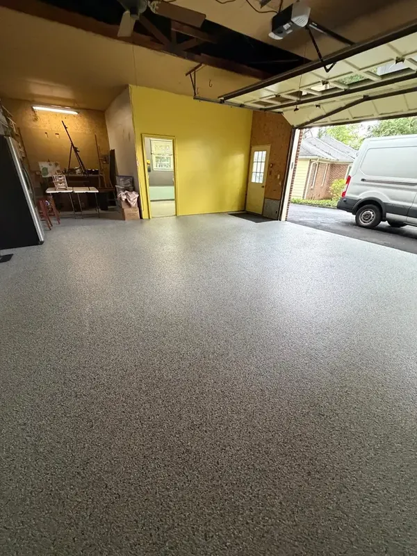 Finished Tidal Wave flake floor looking out through the open garage door in Annandale, VA