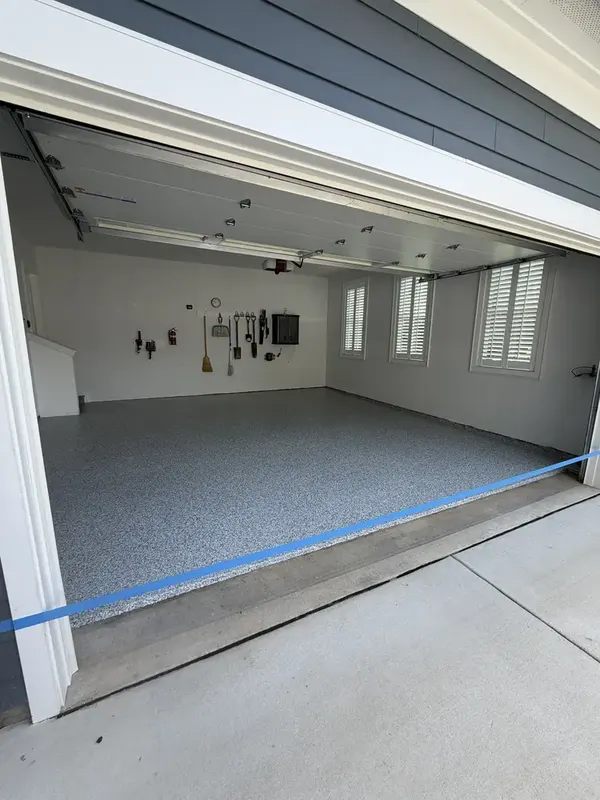 Gravel flake garage floor seen through the open door of a Herndon, VA two-car garage
