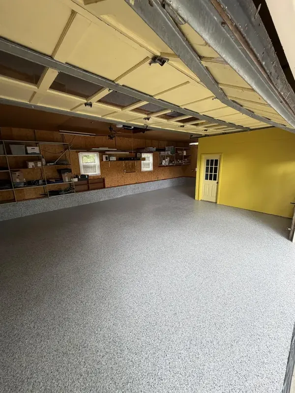 Wide view of the Tidal Wave flake garage floor beneath the open overhead door in Annandale