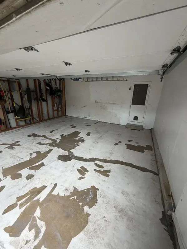 Silver Spring garage slab during preparation, with patches visible before coating