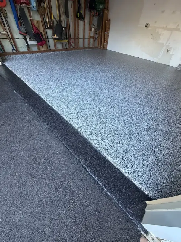 Close-up of the Domino flake floor edge at the entrance of a Silver Spring garage