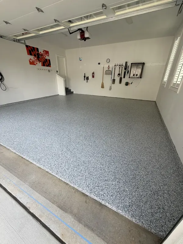 Finished Gravel flake floor inside a two-car garage in Herndon, VA, seen from the apron