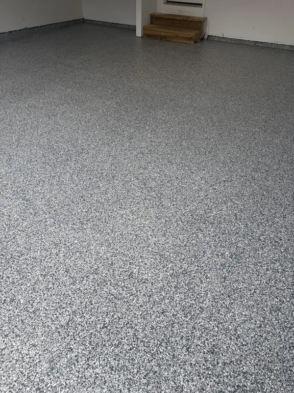 Grey and white Stonehenge flake floor running to the steps at the back of an Arlington, VA garage