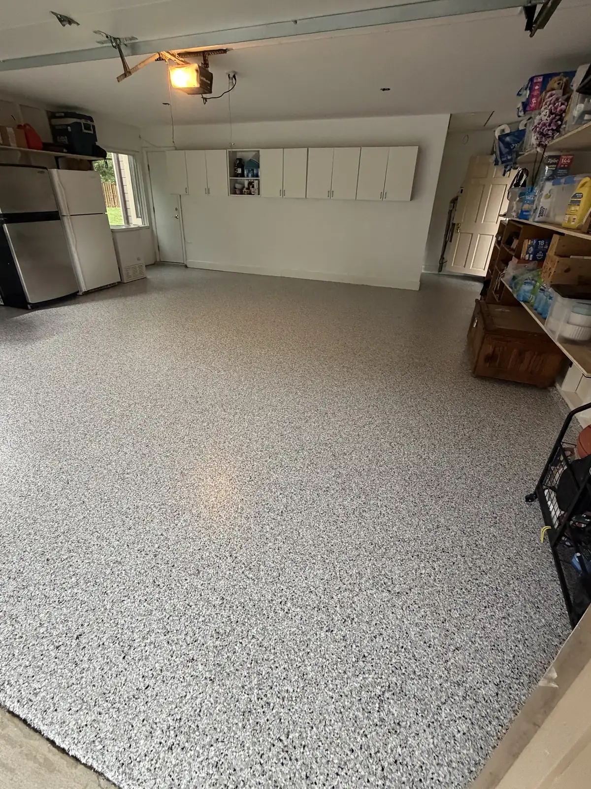 The same garage after coating: grey full-flake epoxy floor