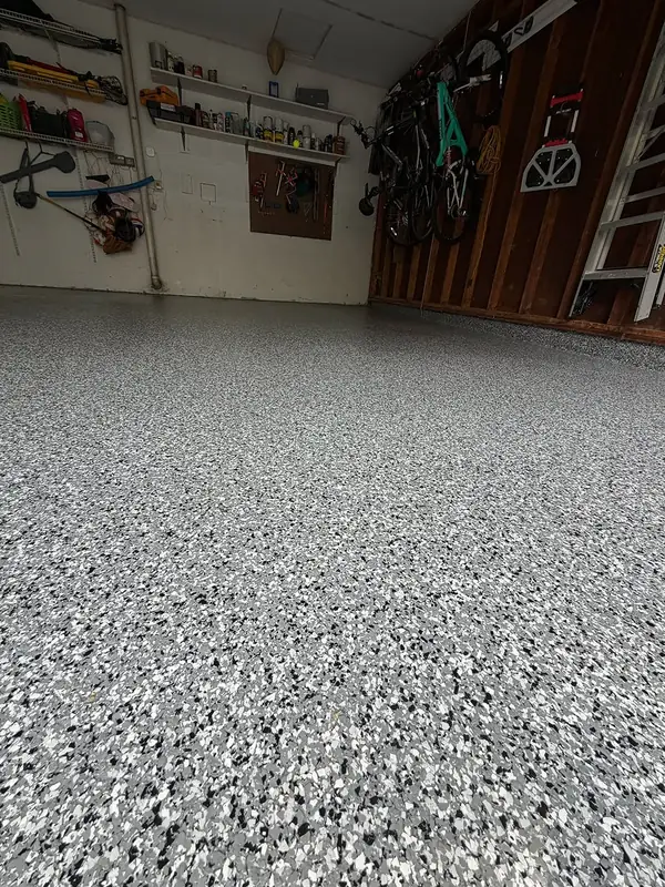 Close view of the grey, black and white Wombat flake floor in a Herndon, VA garage